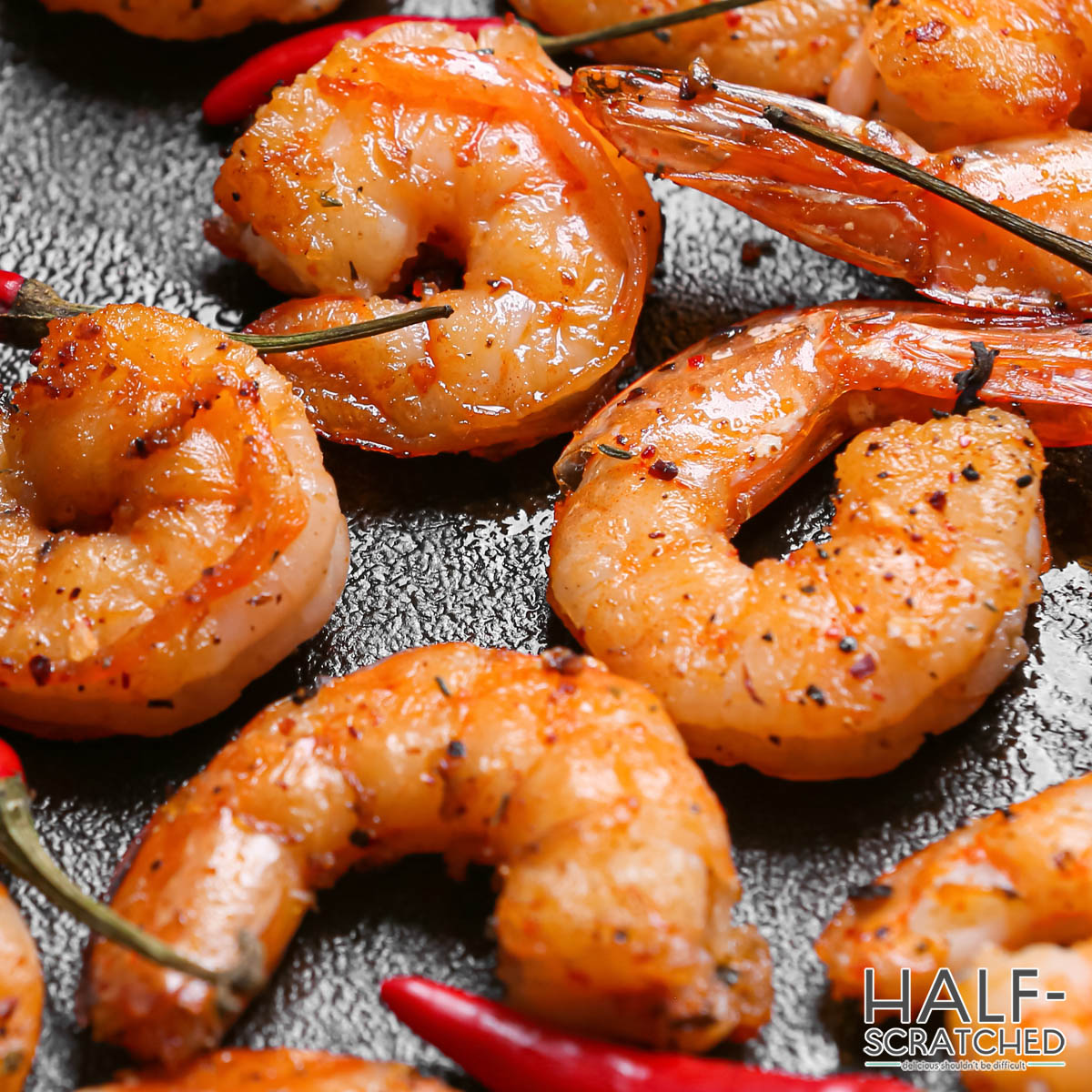 Shrimp cooking on a oven tray