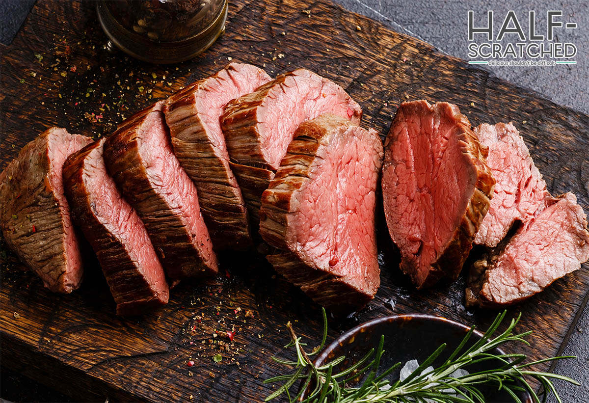 Roasted beef tenderloin sliced and served