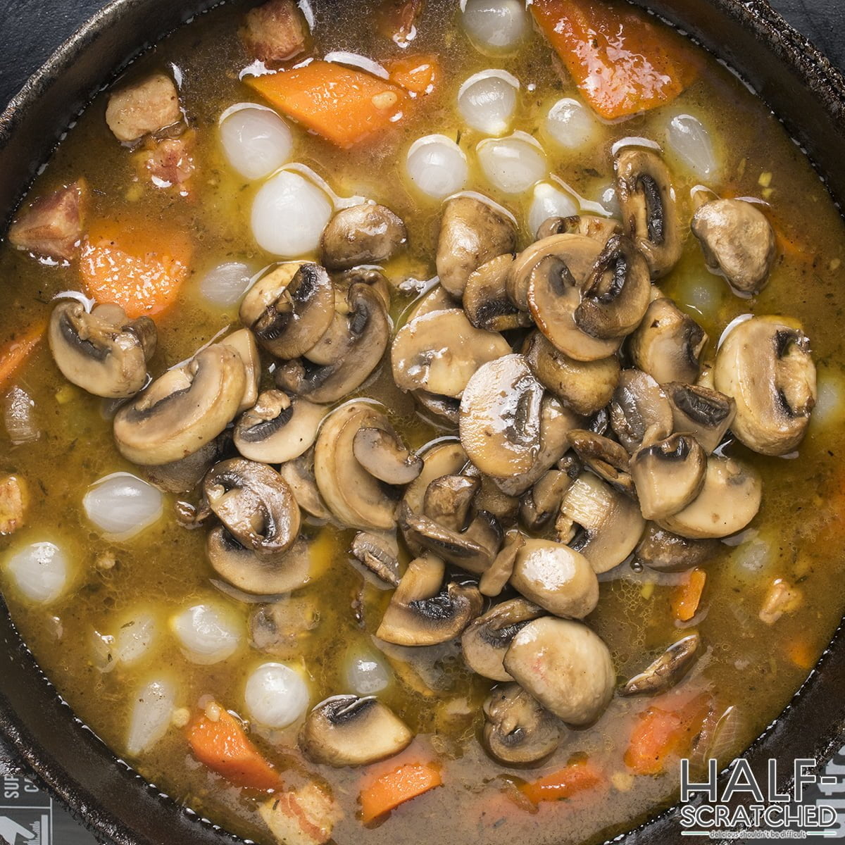 Adding mushrooms to a pot