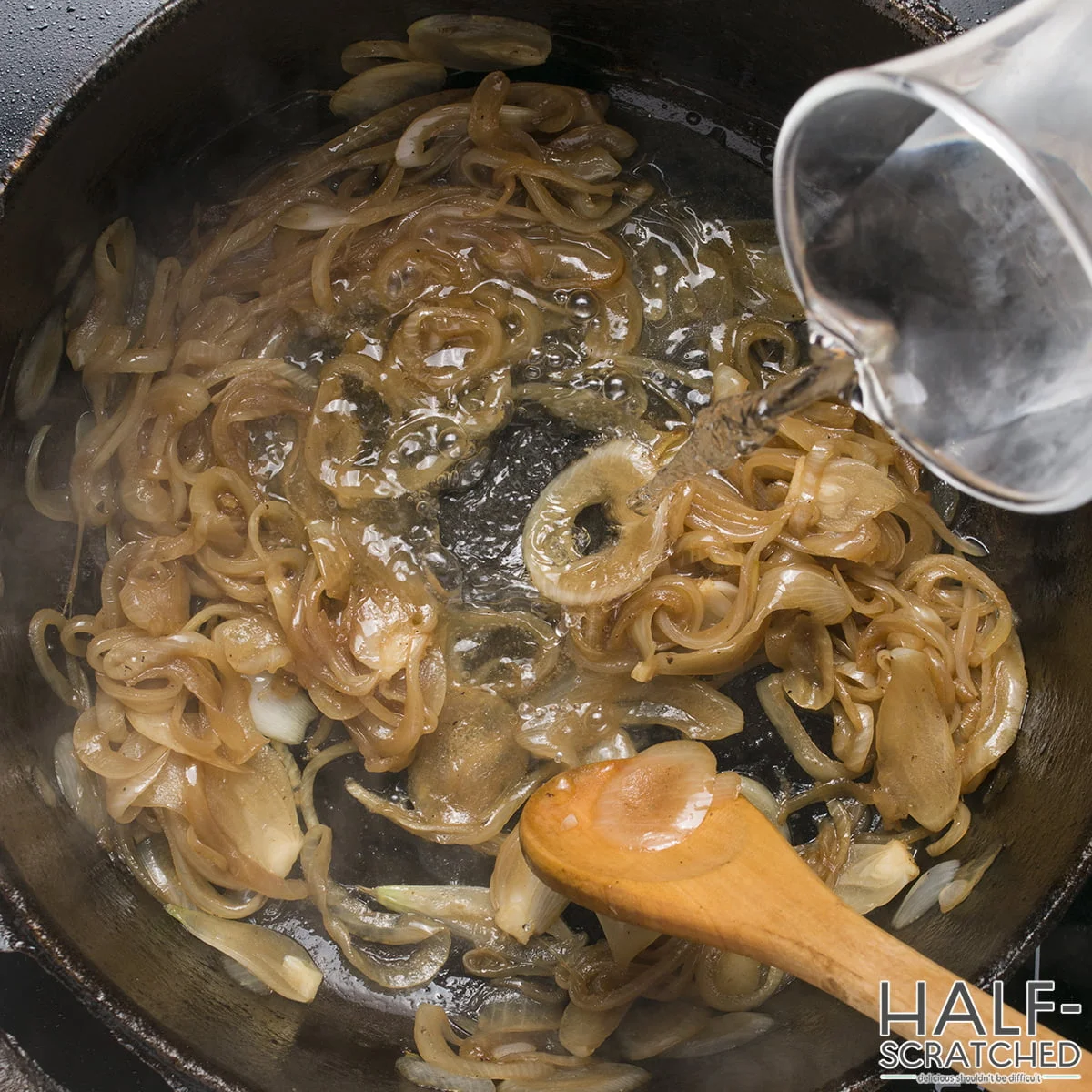Adding water, to the onions