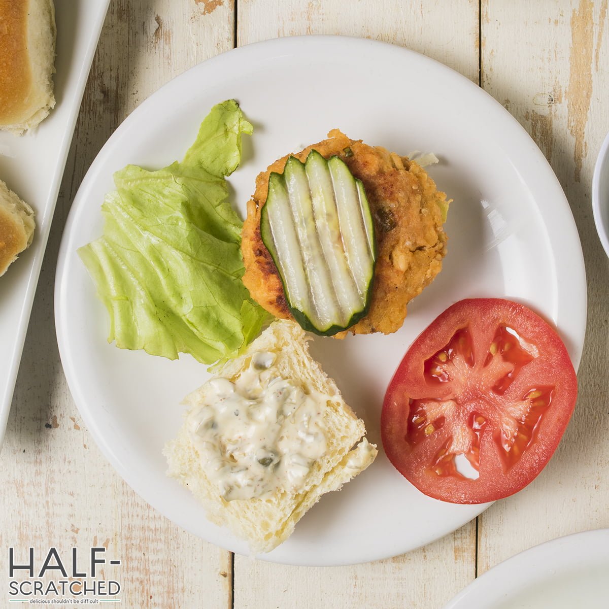 Assembling sandwiches with salmon patties