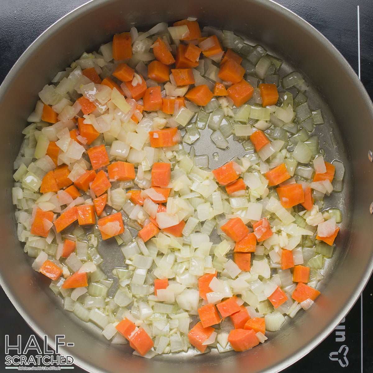 Carrot, onion and garlic in a pot