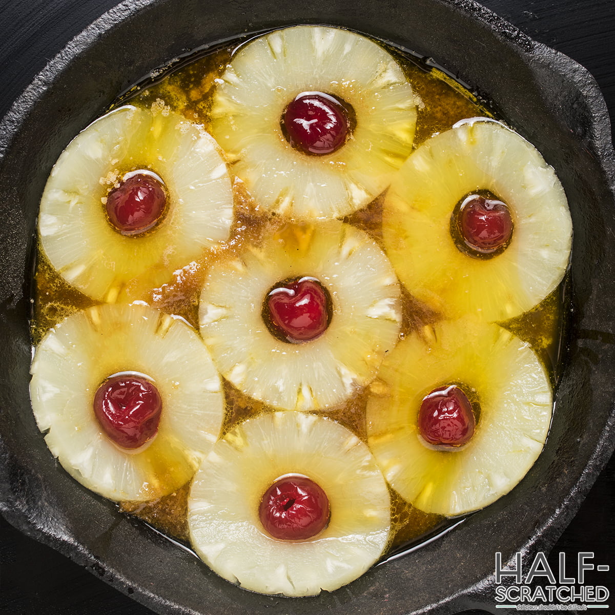 Cherries and pineapple slices in skillet
