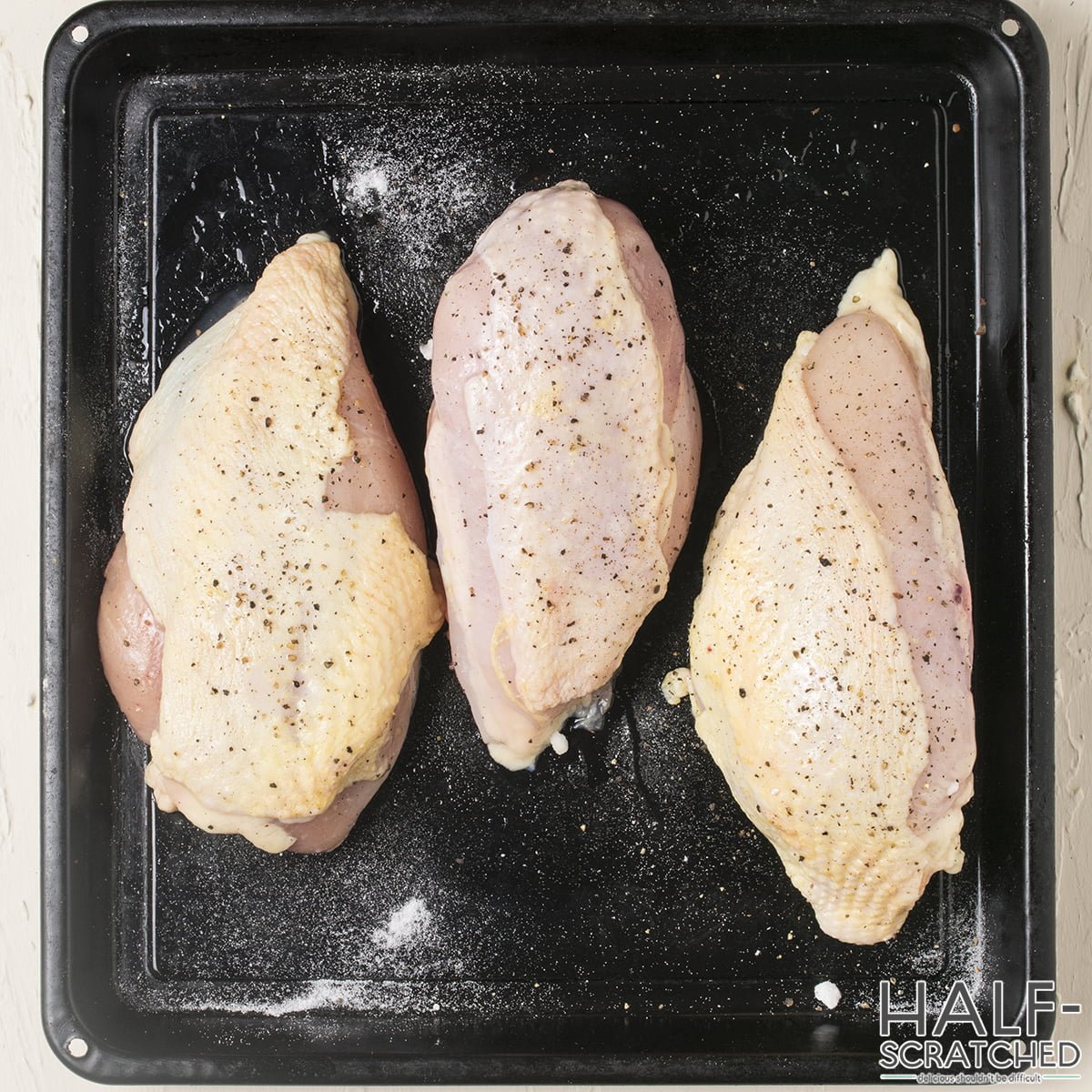 Chicken breasts on baking sheet