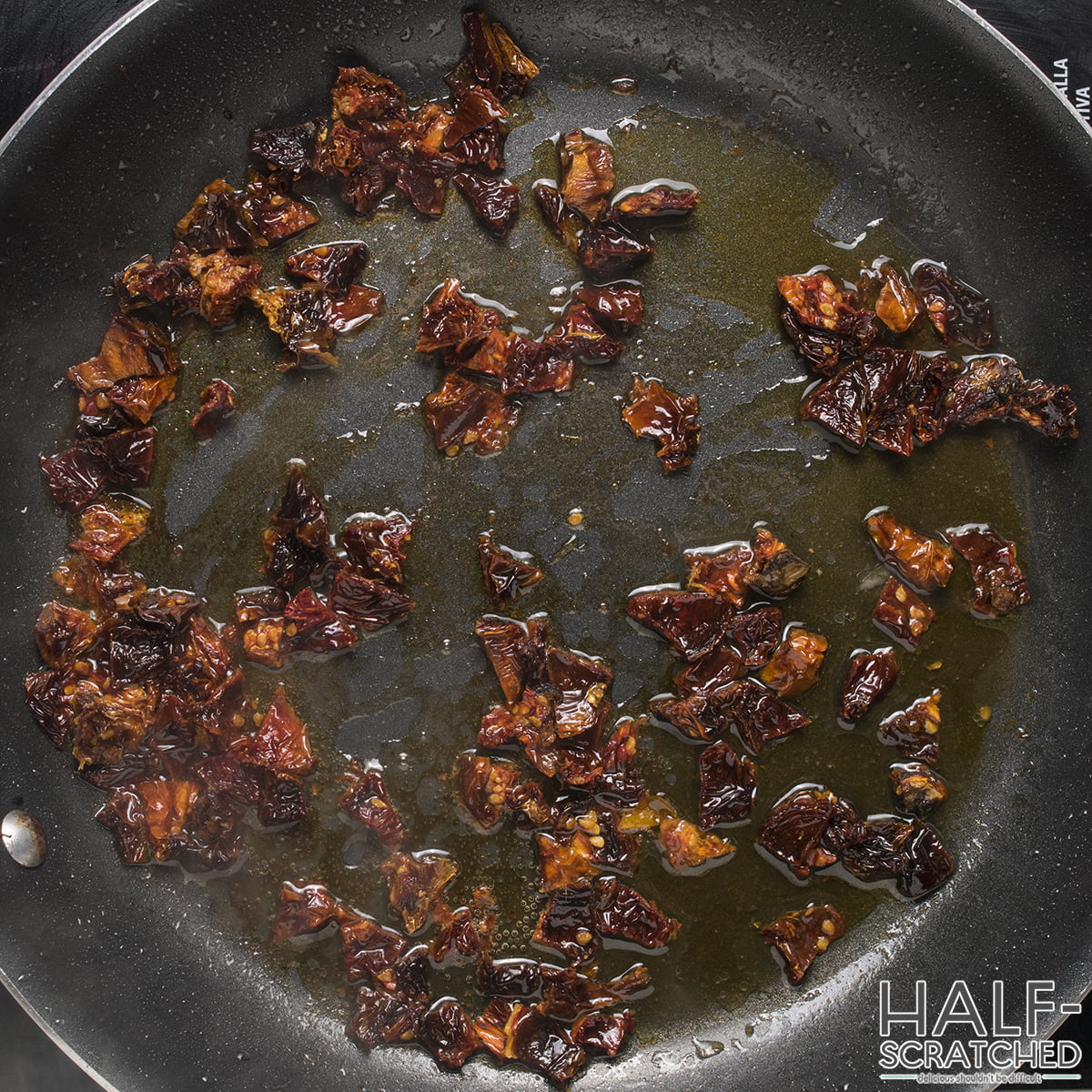 Dried tomatoes in frying pan
