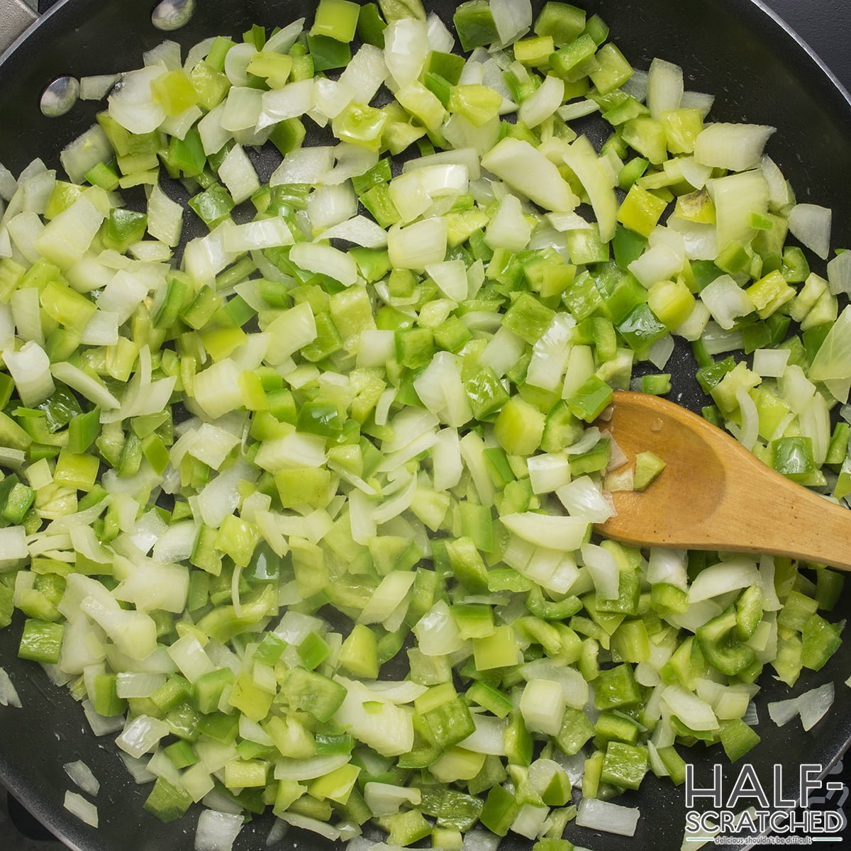 Frying chiles, jalapenos, poblano, and onions 