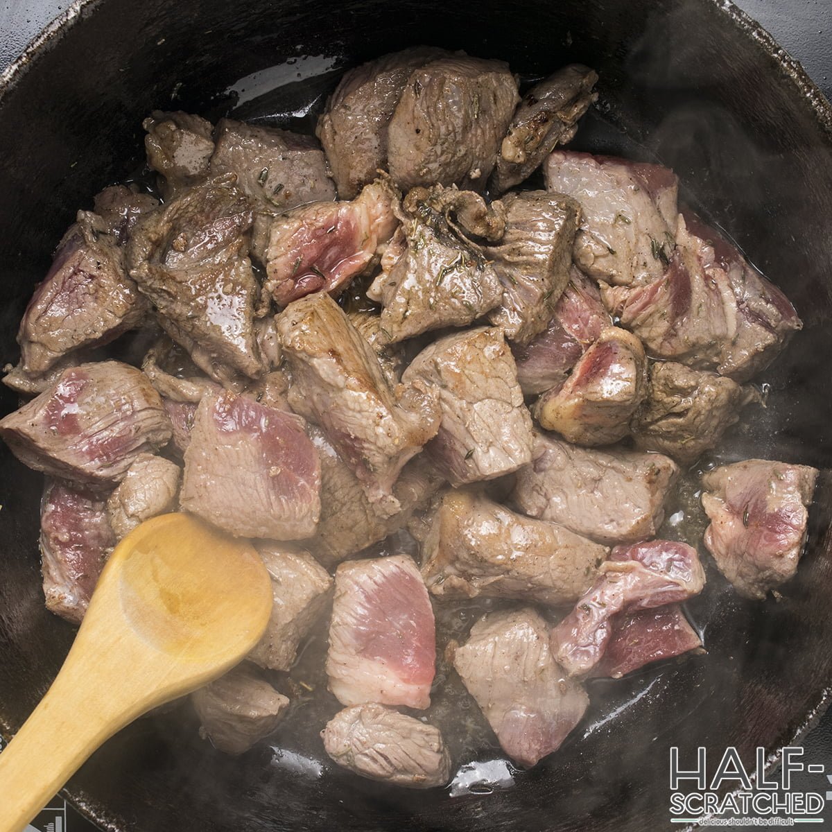 Pieces of beef in frying pan