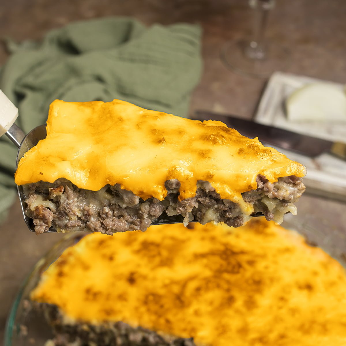 Close view of a slice of cheeseburger pie