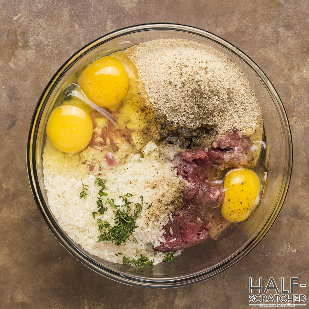 ground chuck with the onions, breadcrumbs, rice, eggs, thyme, salt, and pepper in a bowl