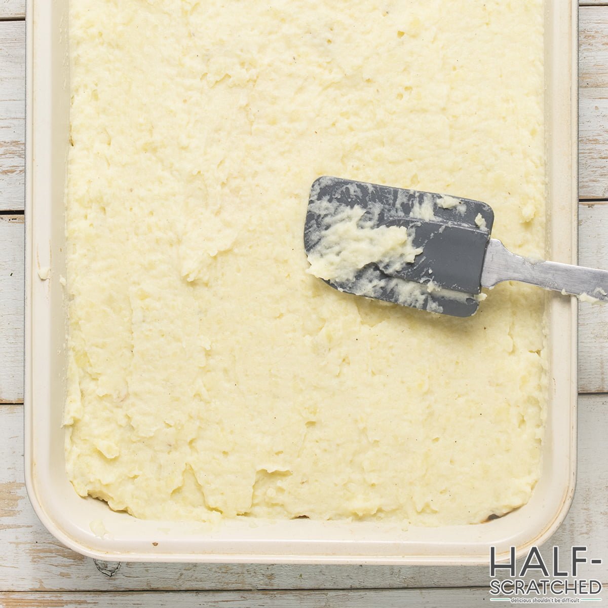 Baking dish with mashed potatoes on top