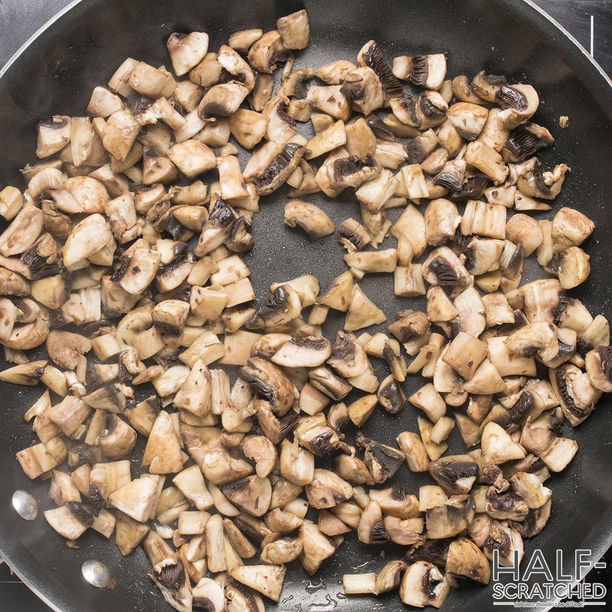 Mushrooms in pieces in frying pan