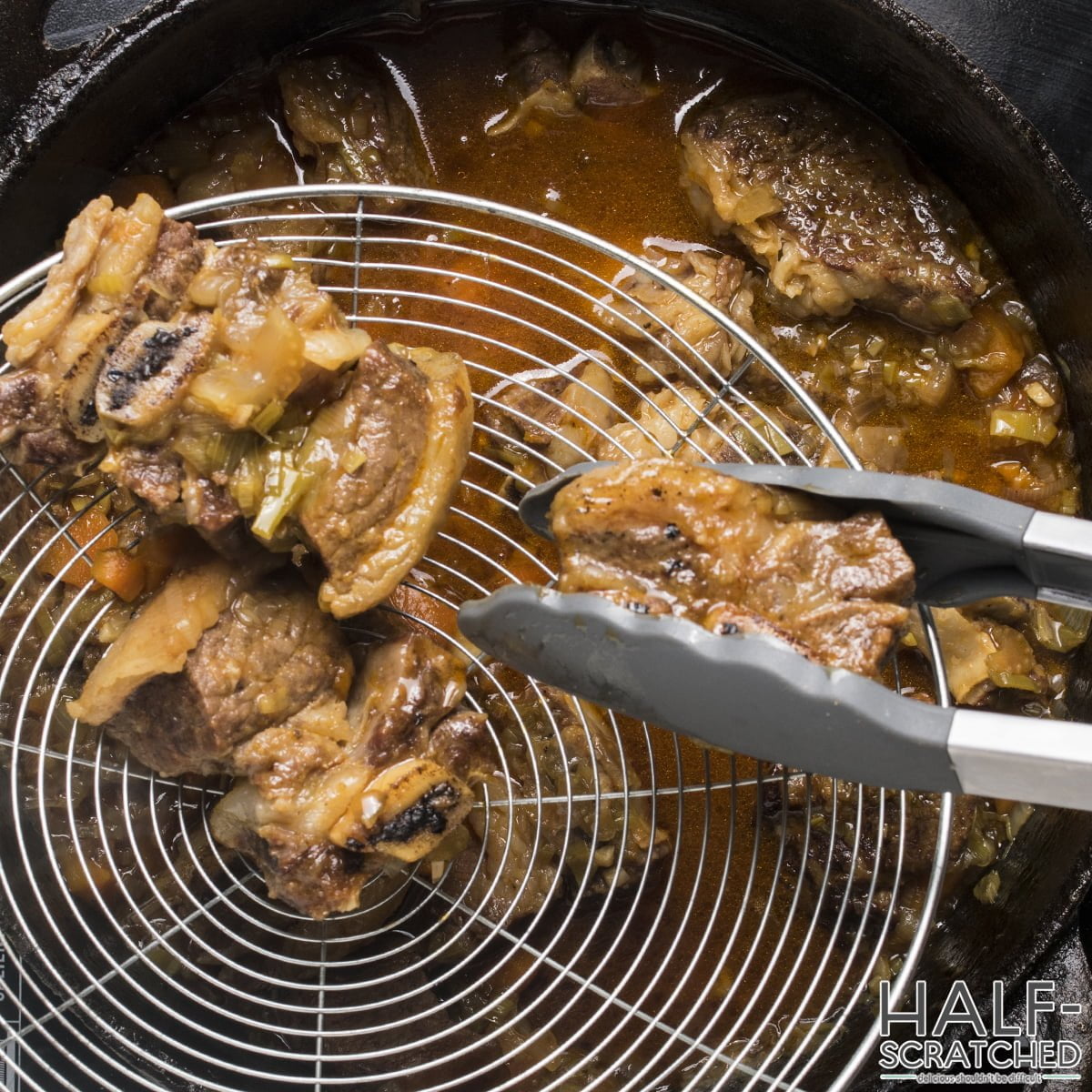 Transferring short ribs to a plate