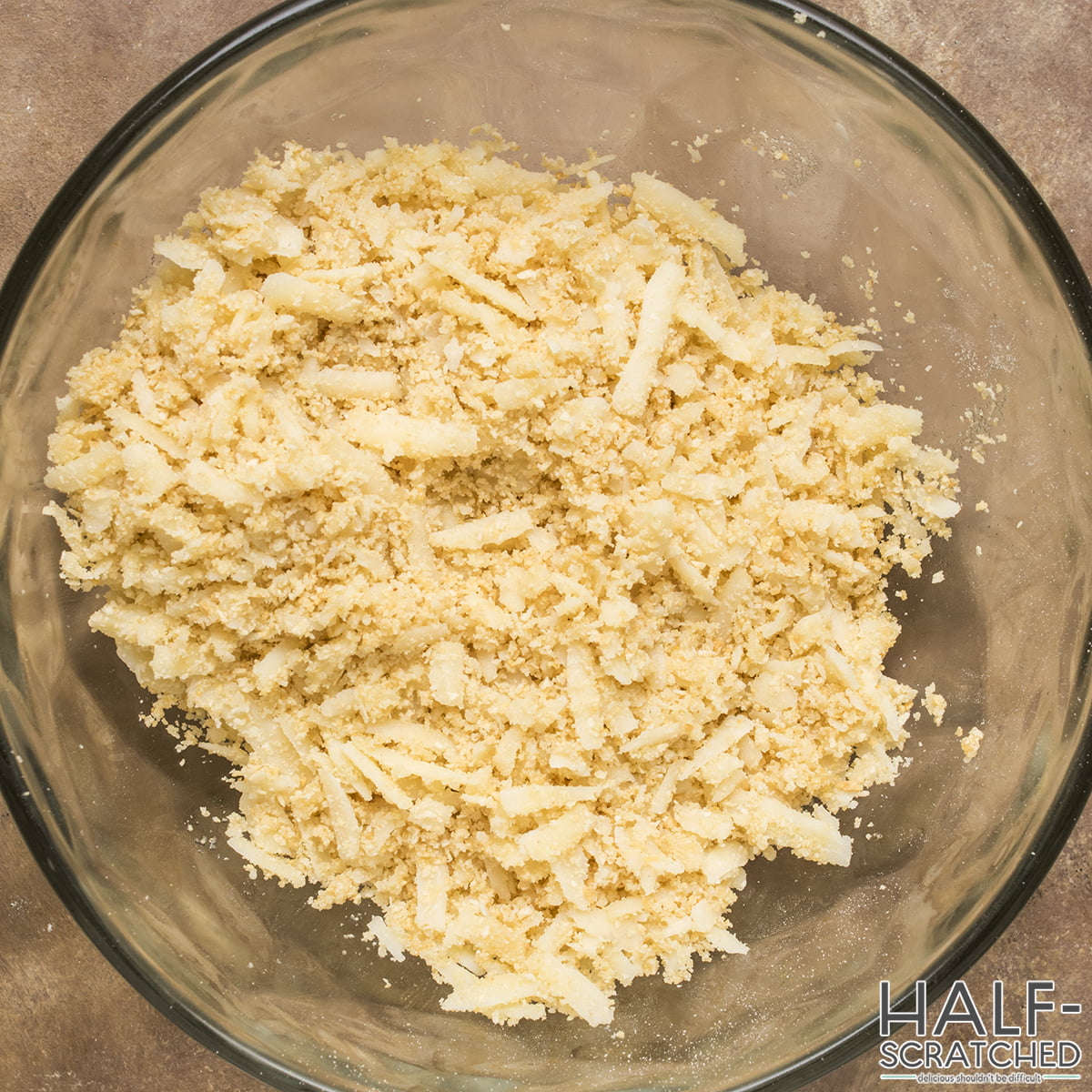 A bowl with Parmesan and breadcrumbs. 