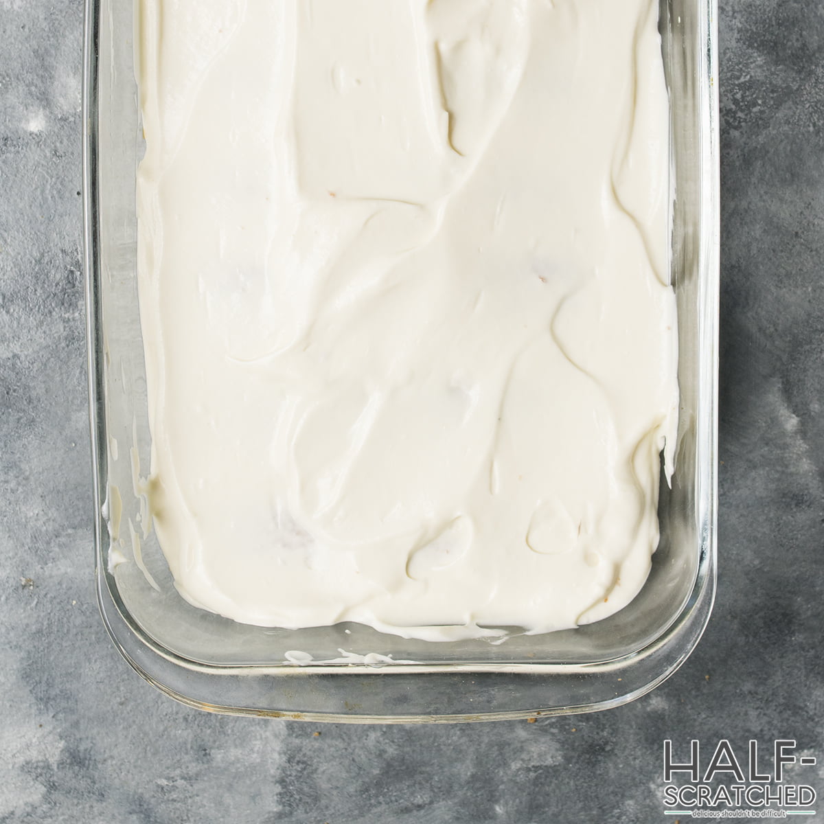 Spreading cream mixture in a baking dish