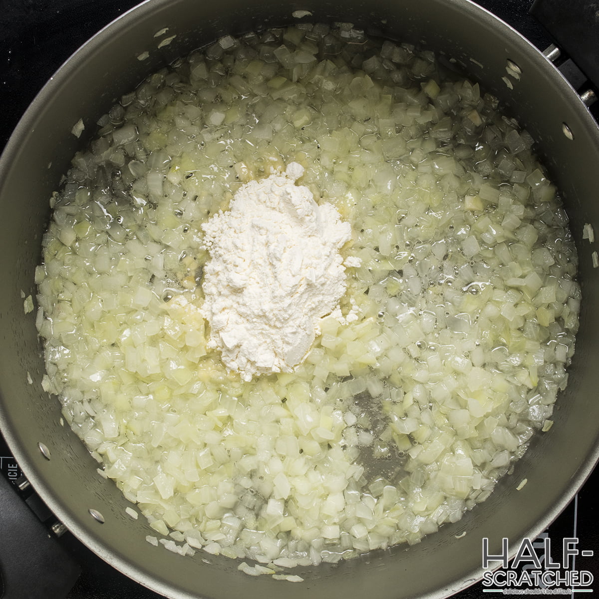 Flour and onion in a pot