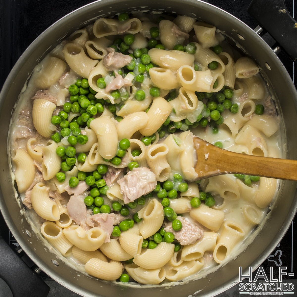 Pasta, tuna, and peas in a pot