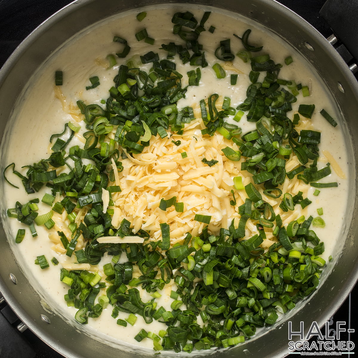 Scallions and gruyere in sauce