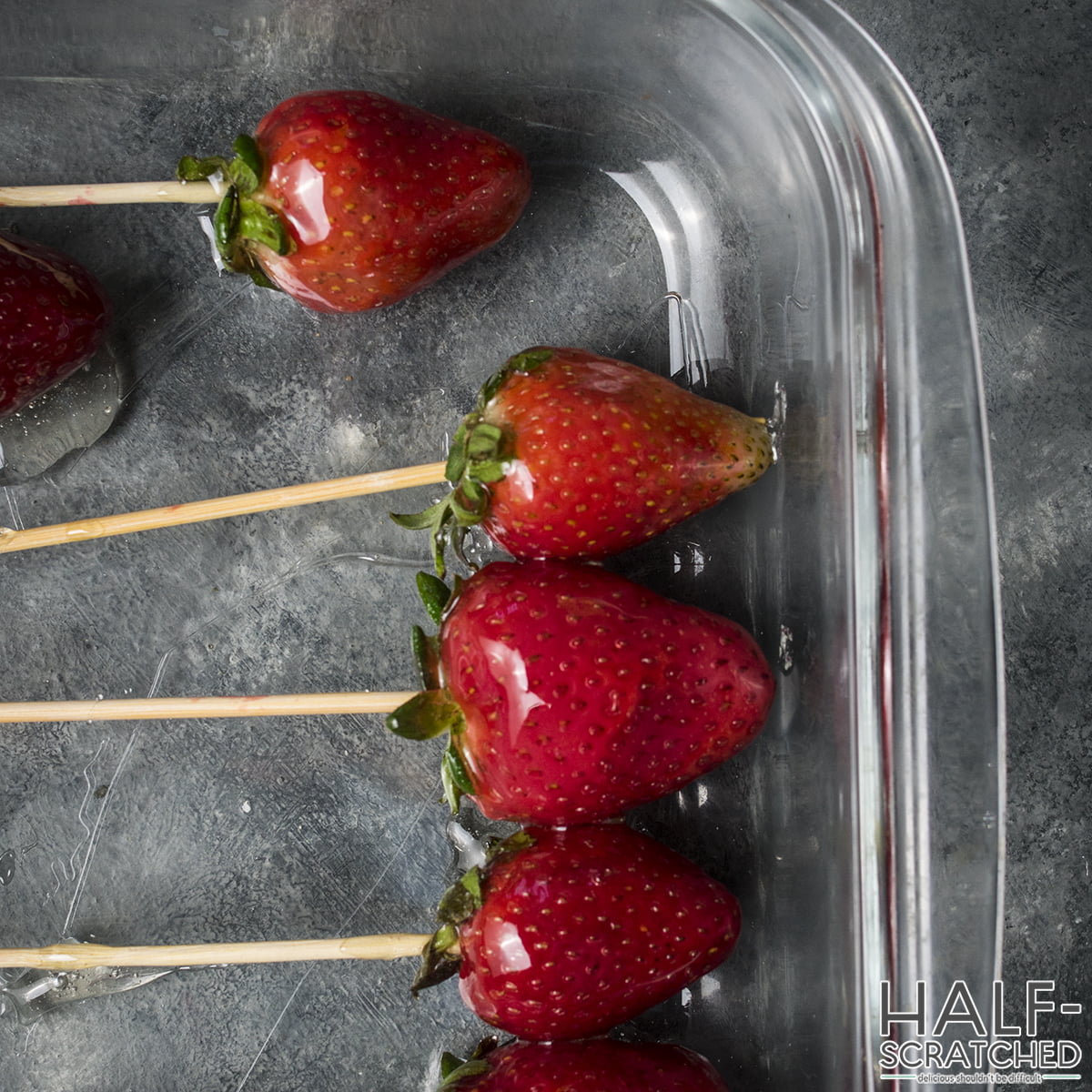 Strawberries with syrup in a baking dish