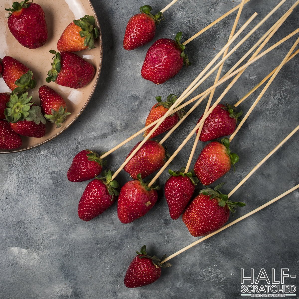 Toothpicks into strawberries