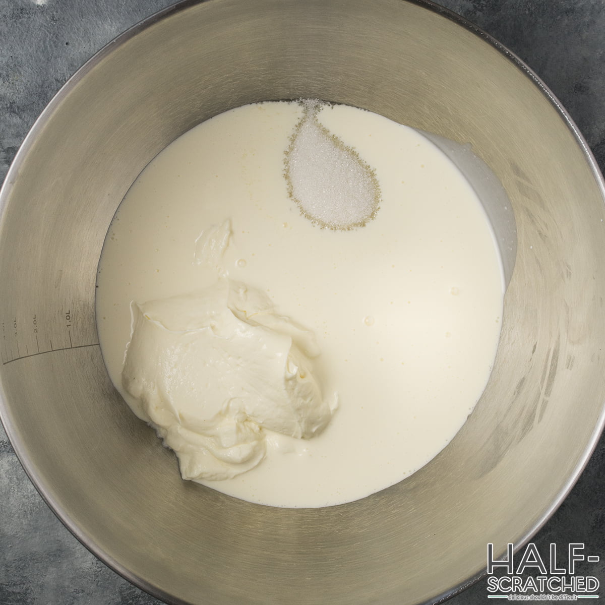 Cream cheese, sugar and heavy cream in a bowl