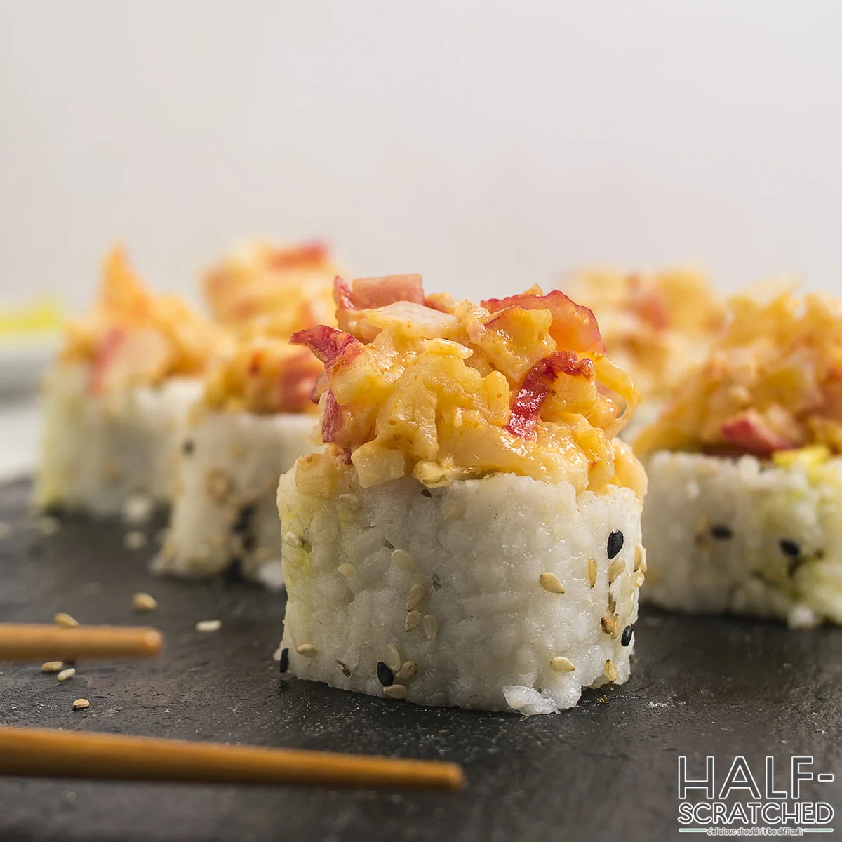 Volcano Roll Sushi Pieces on Slate Board