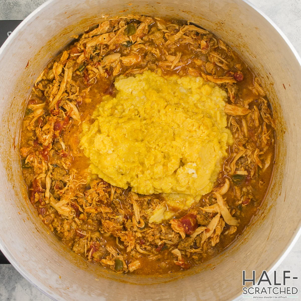 Close-up of Brunswick Stew with corn cream topping in pot